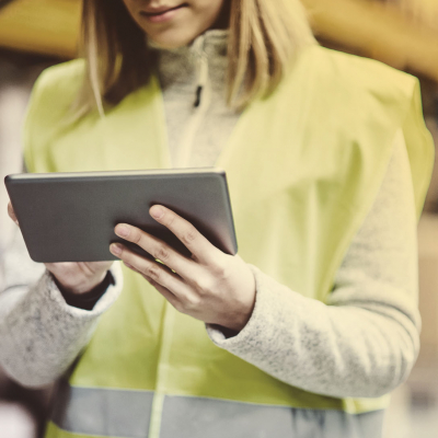 Lady in high-vis holding an iPad