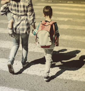 school safety mother-and-her-children-crossing-a-road