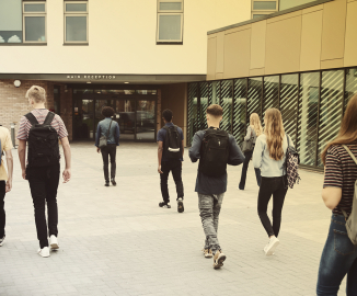 Students entering a school building